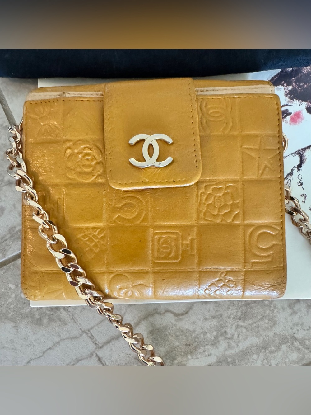 CHANEL Embossed Camellia Grid Leather Crossbody in Mustard